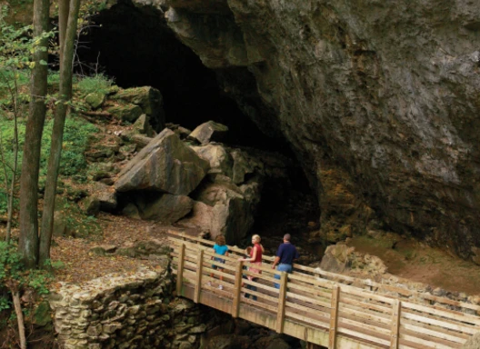 Group of people exploring the mouth of Maquoketa Cave