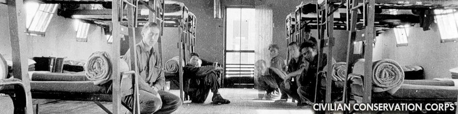 Civilian Conservation Corps bunkhouse with members in old black and white photo.